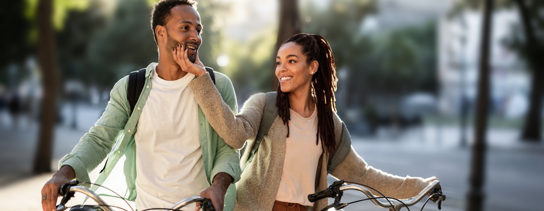 two people outside with bikes