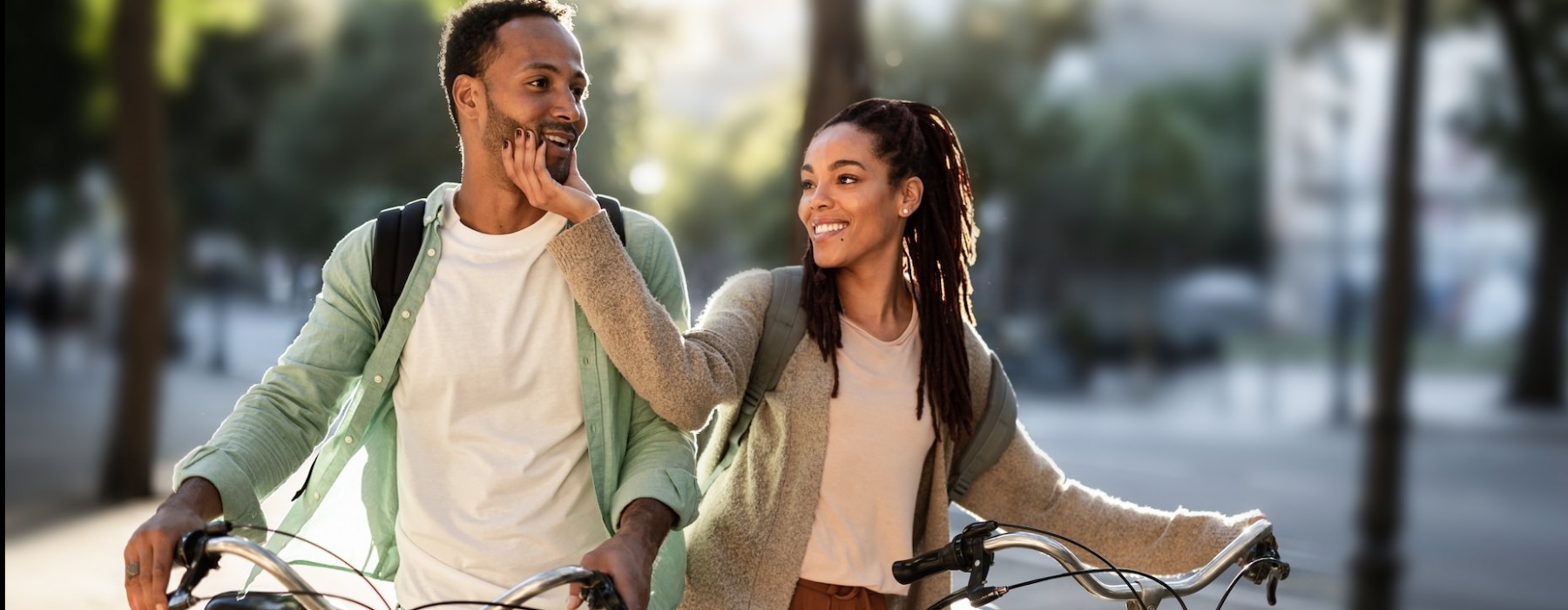 two people outside with bikes