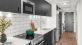 a kitchen with black cabinets