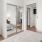 a bedroom with a large mirror
