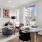 a living room with a table and chairs